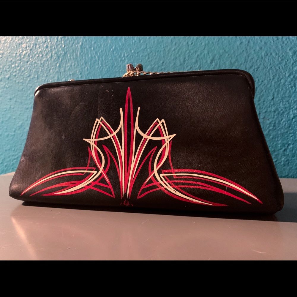 Vintage clutch with custom pinstripe design.